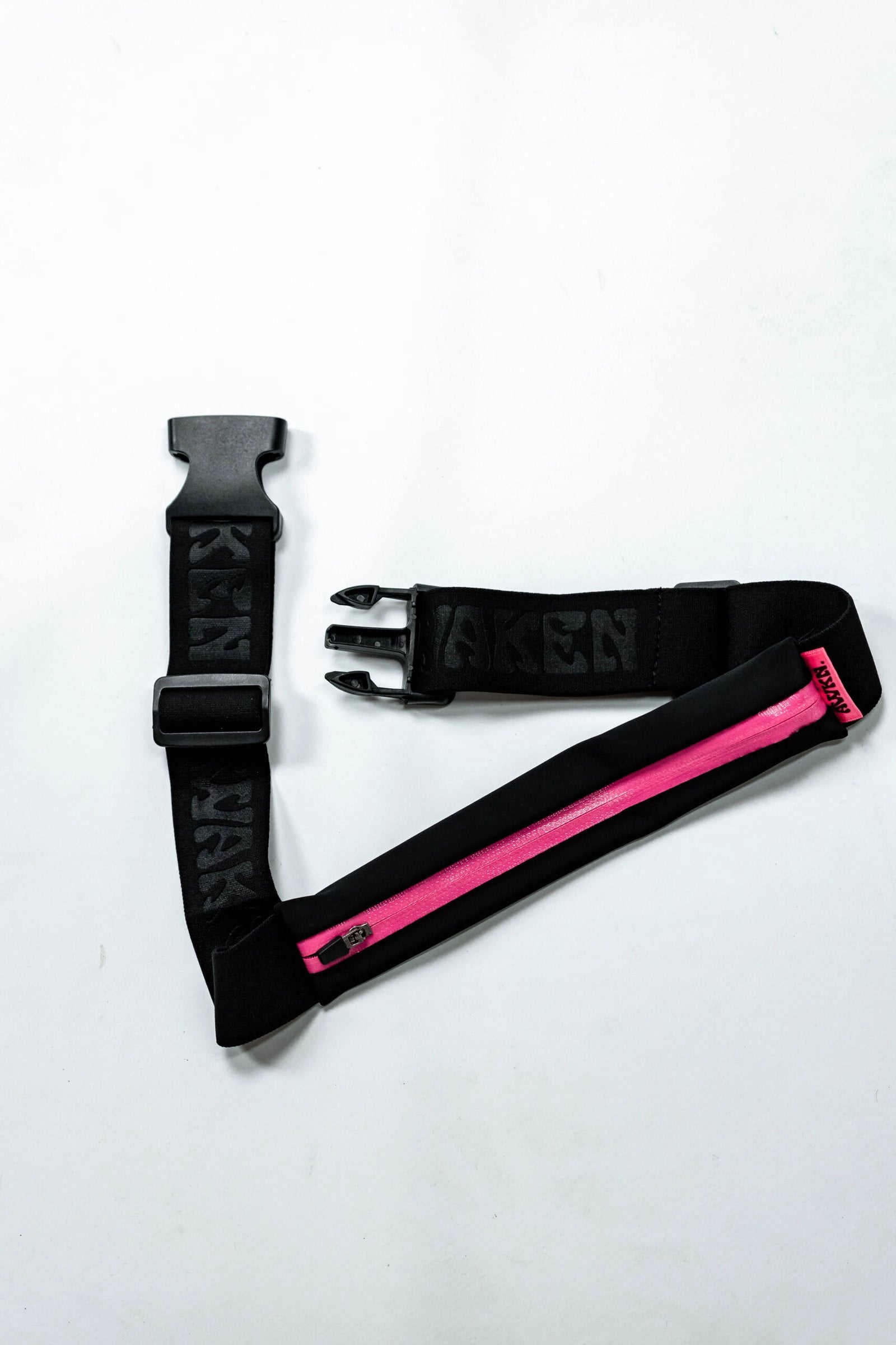 Cinturon carrera con banda ajustable negro y rosa