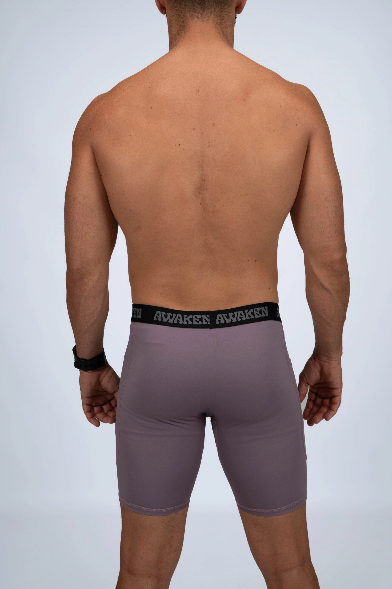 malla compresiva hombre trasera logo color lila arándano