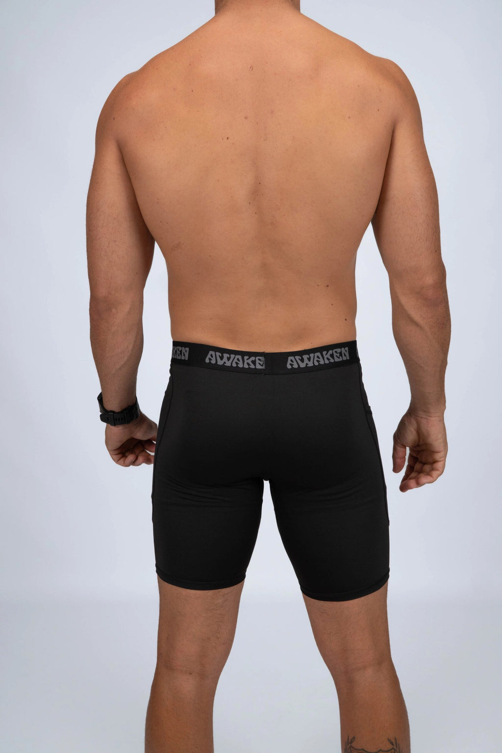 malla compresiva hombre trasera logo color negro